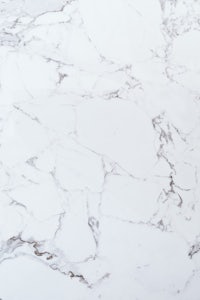 a close up of a white marble surface